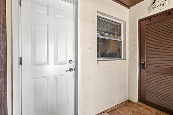 Enclosed Entry with Laundry room Door
