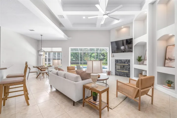 Large open-concept great room with tray/coffered ceilings
