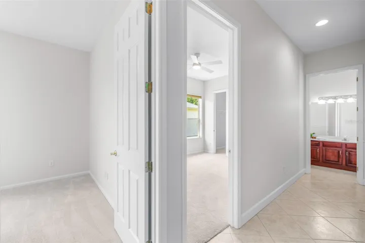 Split floorplan offers secondary bedrooms and bathrooms privately situated in the rear wing of the home