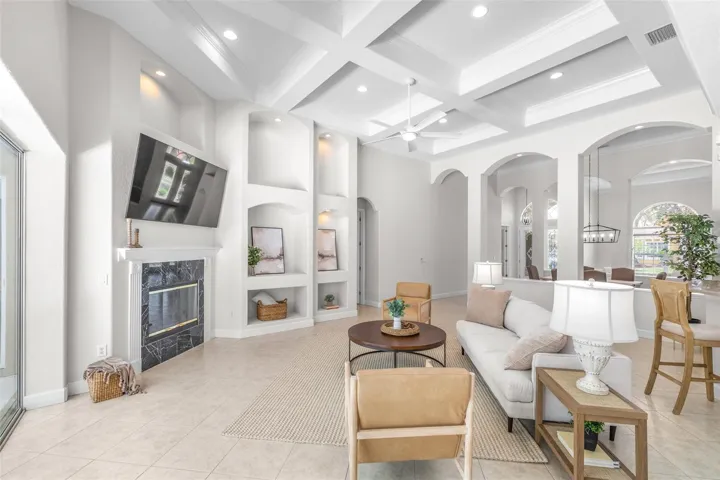 Beautifully designed gathering space with built-in features and wood-burning fireplace