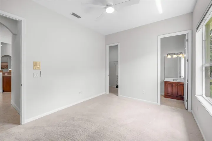 Flexible secondary living space ideal for a media room, fitness area, or guest retreat with en-suite bathroom and large walk-in closet