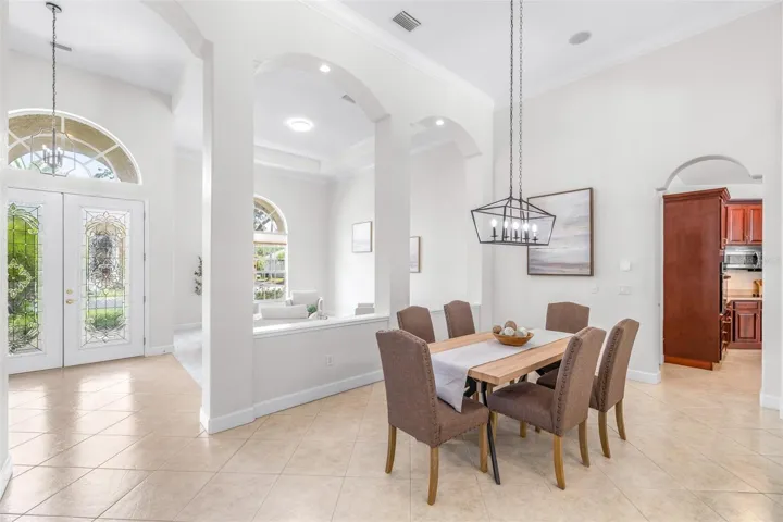 Elegant formal dining area with open flow to main living spaces and kitchen