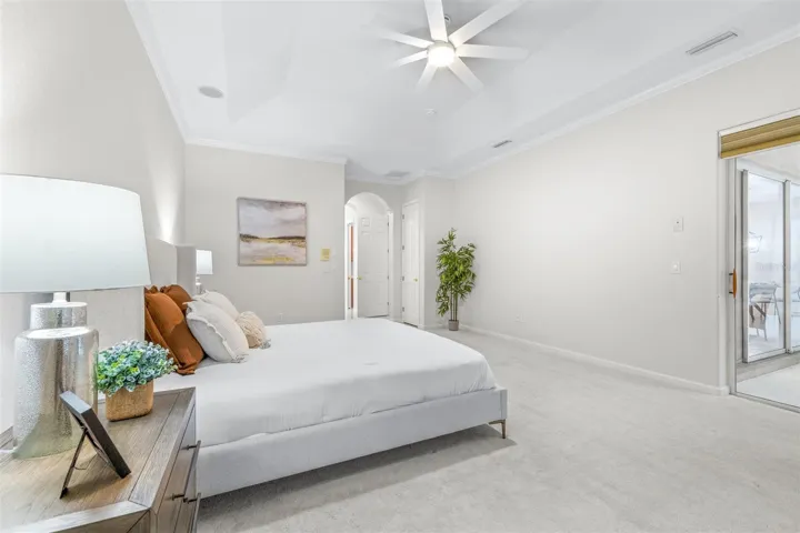 Oversized primary bedroom retreat with abundant natural light and peaceful ambiance