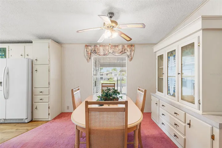 VIEW OF DINING ROOM. KITCHEN IS TO THE LEFT
