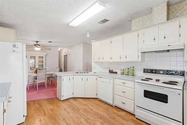 VIEW OF KITCHEN TOWARDS DINING ROOM