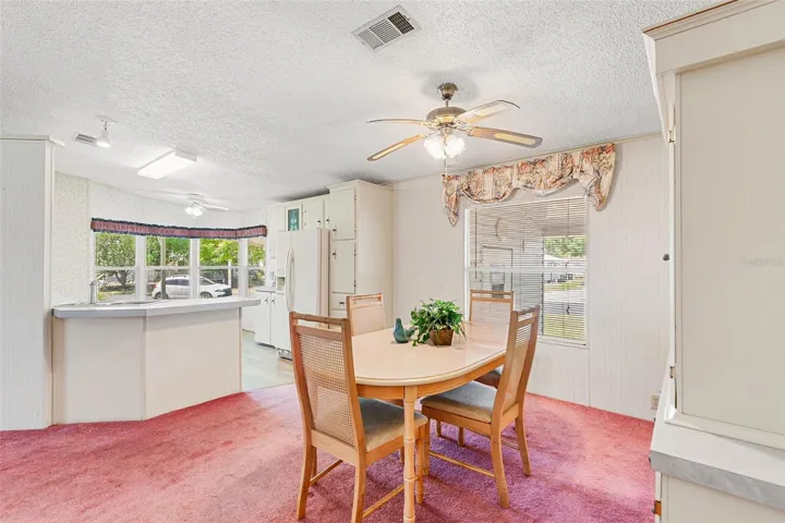 VIEW TOWARDS DINING ROOM AND KITCHEN