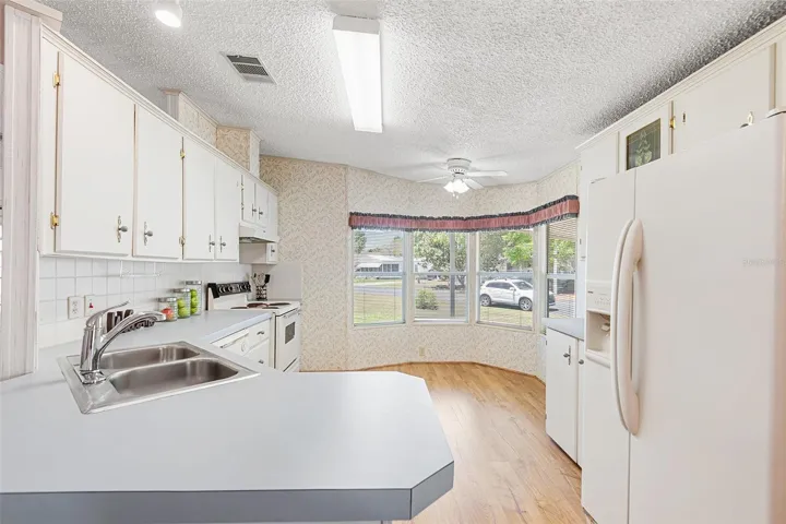 KITCHEN WITH DINING NOOK AREA