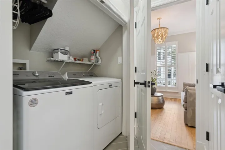 Laundry closet.  Washer and Dryer convey.