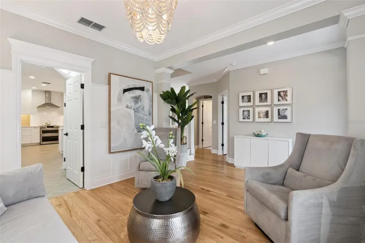 Formal living room shows access to kitchen.  Office and half bath are in background.