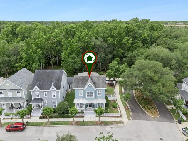 Overhead view of home with well manicured sidewalks.