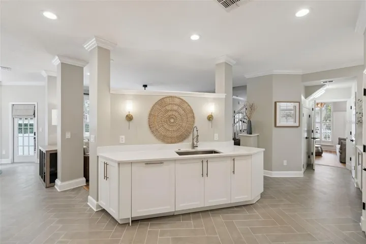 Porcelain tile throughout kitchen and dining.