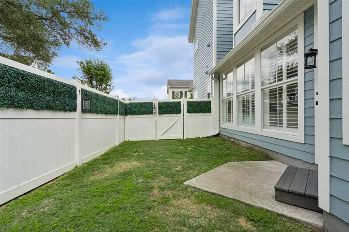 Private yard with gates at front and rear.