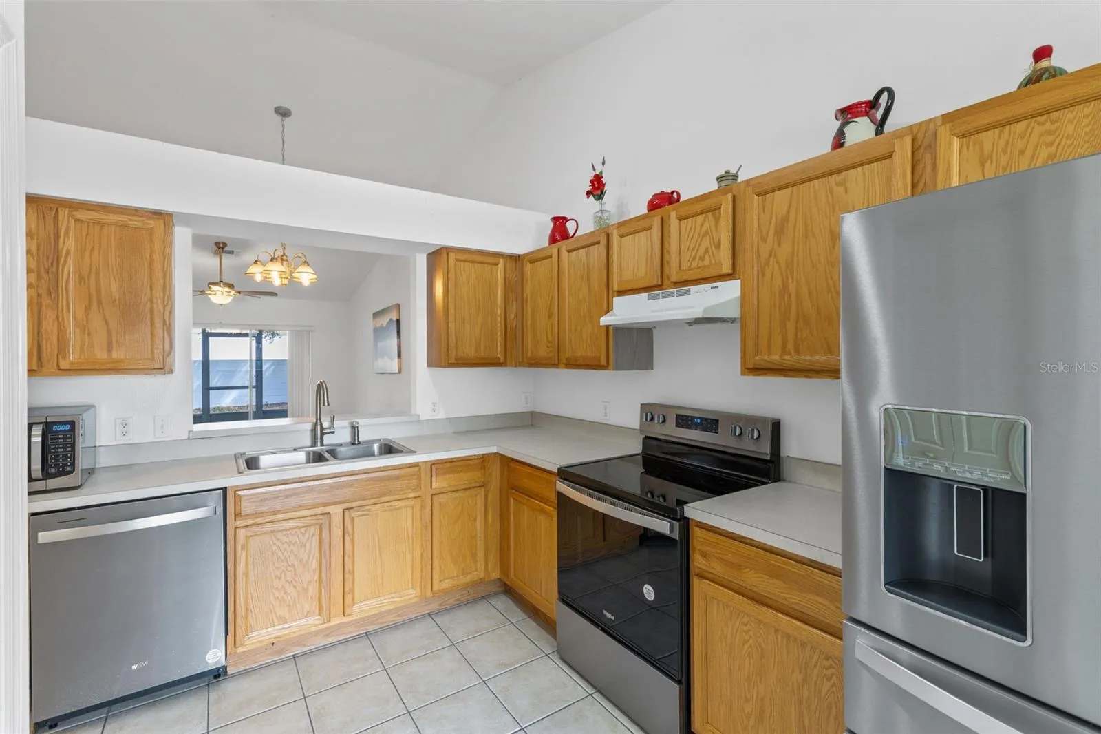 Kitchen with passthrough window to Dining/Living area