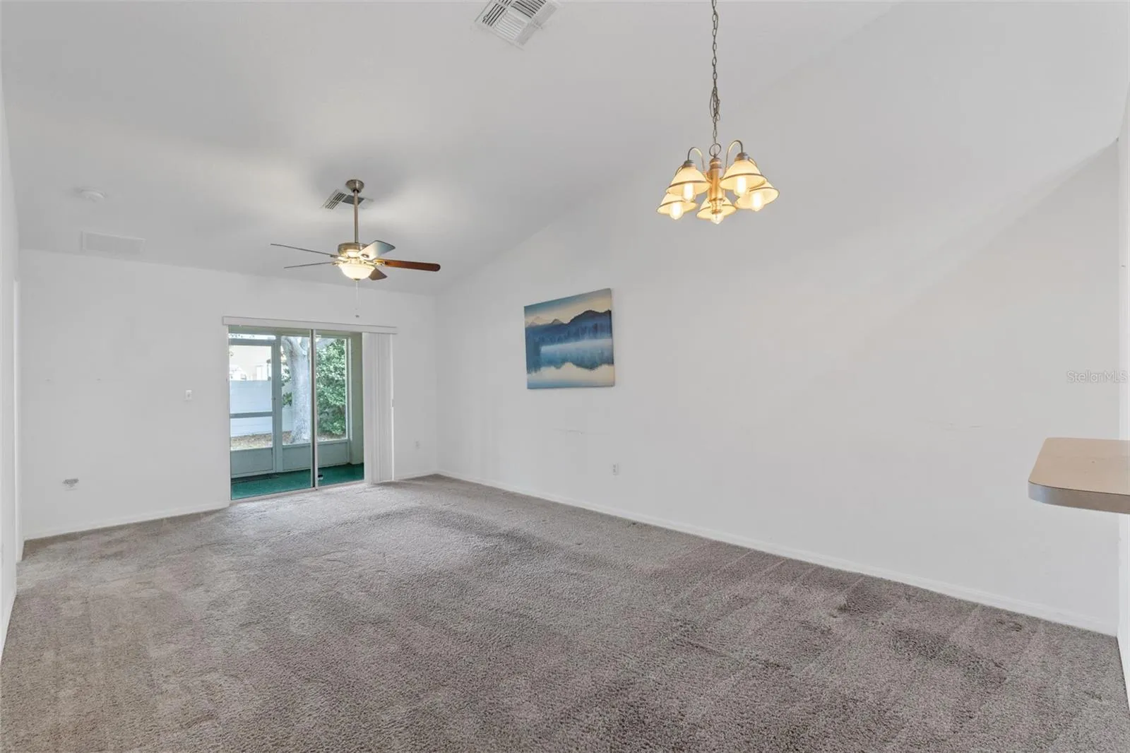 Living/Dining area with access to rear screened patio