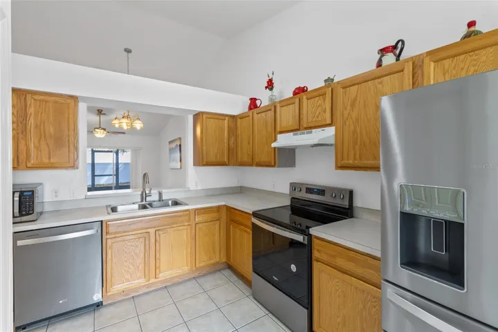 Kitchen with passthrough window to Dining/Living area