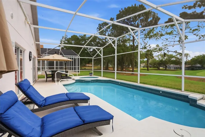 Pool/hot tub with golf course views