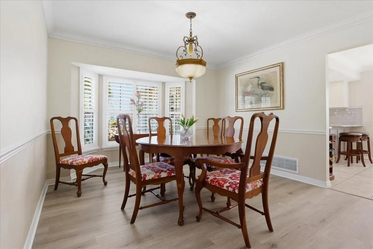 Designated Dining Room With French Shutters And Bay Window