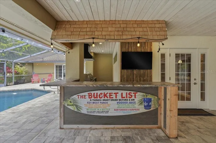 BUILT IN BAR & OUTDOOR KITCHENETTE!
