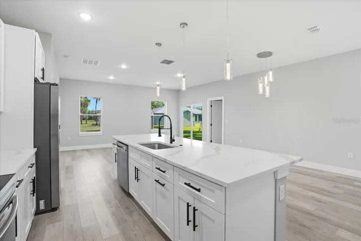 Kitchen facing dining / living area