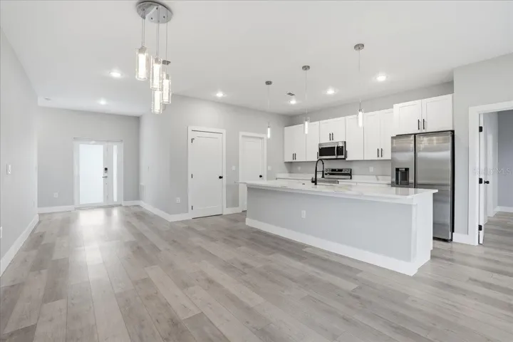 Living room facing dining / kitchen