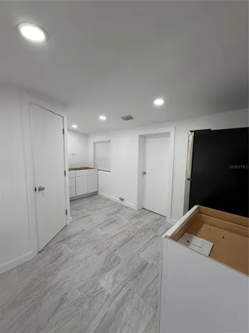Kitchen - Stove Top to be Installed.  Doors lead to Bathroom and Bedroom