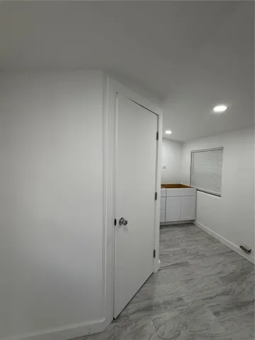 Entry Door to Bathroom located in Kitchen Area