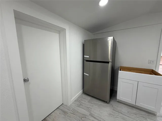 Entry door to Bedroom.  Counter Top Installed and Stove Top and Microwave Oven to be Installed