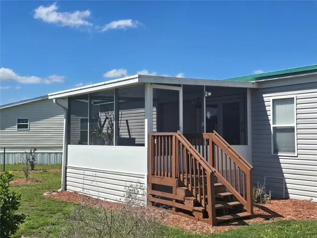 Screen enclosed porch, steps, gutters/downspouts, vinyl siding to ground for a seamless look (no skirting) 2 access panels to crawlspace.