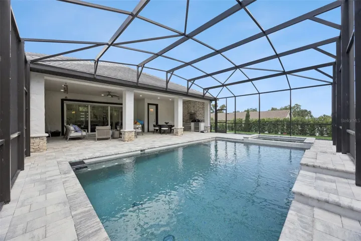 Lanai with sparkling pool and spa