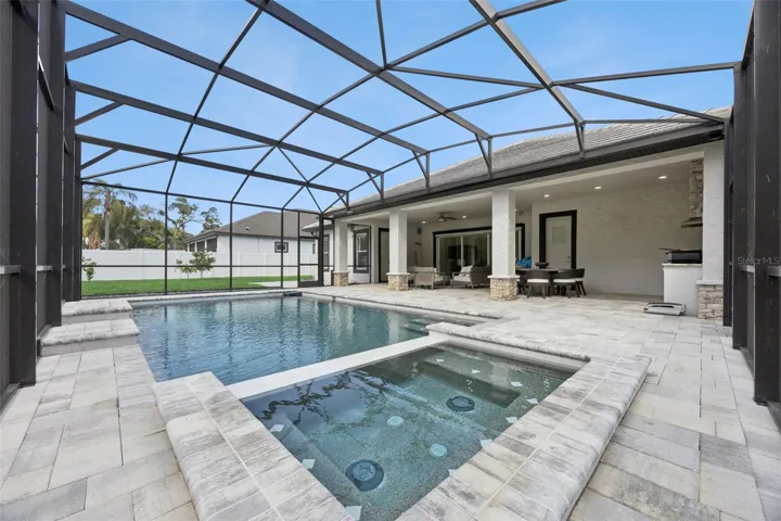 Lanai with sparkling pool and spa