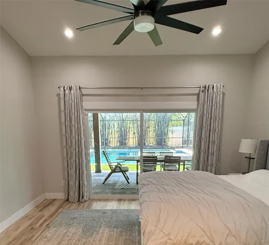 Primary bedroom with pool view