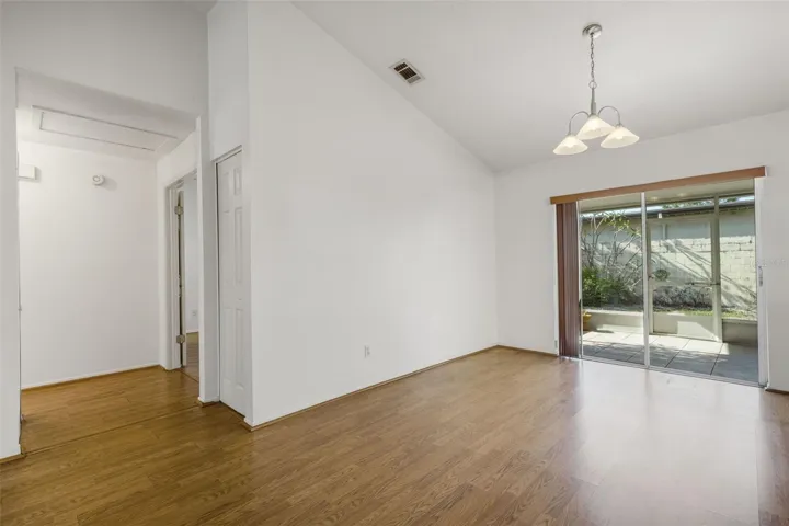 Dining room has great view of screened lanai and private, fenced backyard