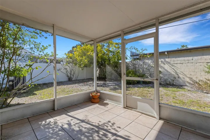 Roomy screened lanai with views of private backyard