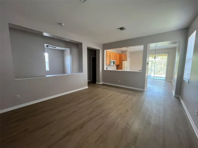 living room with view of eat in kithchen area