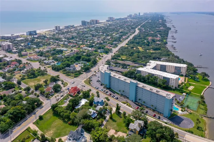 Stunning aerial perspective highlighting the property’s close proximity to both the river and the beach.