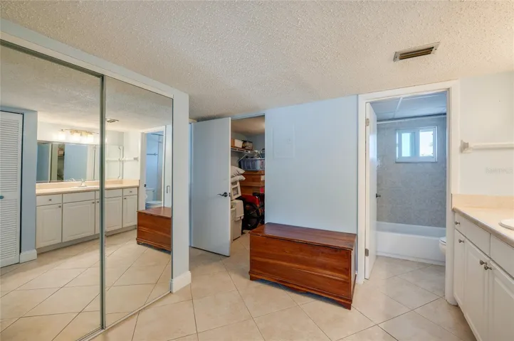 Thoughtfully designed layout connecting the vanity, walk-in closet, and en-suite bath, offering functional flow and generous storage options.