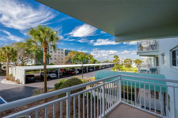 Elevated views of the surrounding grounds with glimpses of the water and lush tropical landscaping.