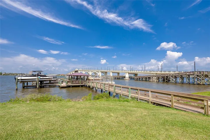 Expansive water views highlighted by a nearby bridge, creating a picturesque and relaxing backdrop.