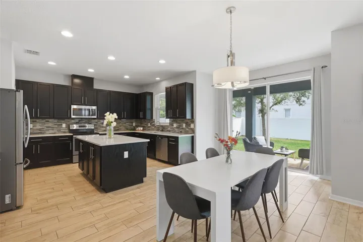 Kitchen, dining area open out to back patio