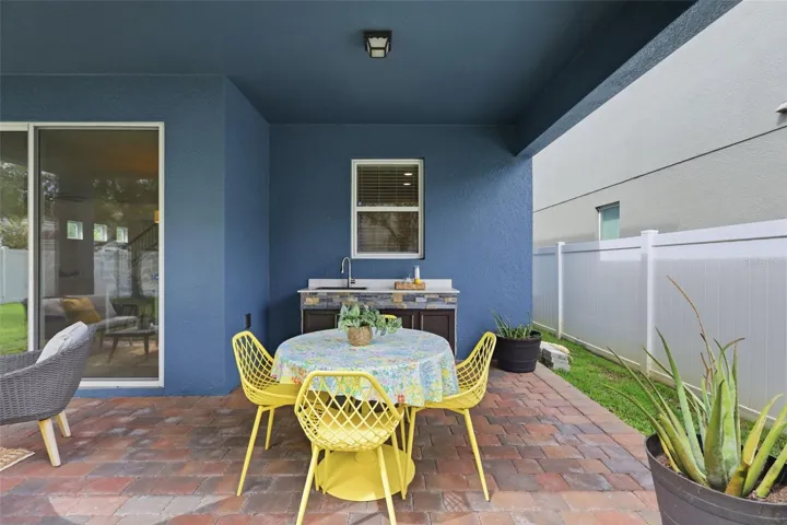 Outdoor kitchen area w/sink and cabinets