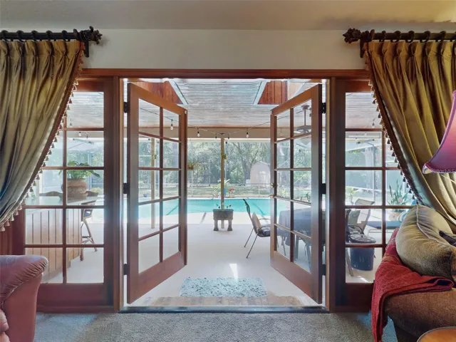 french doors leading from family room to pool