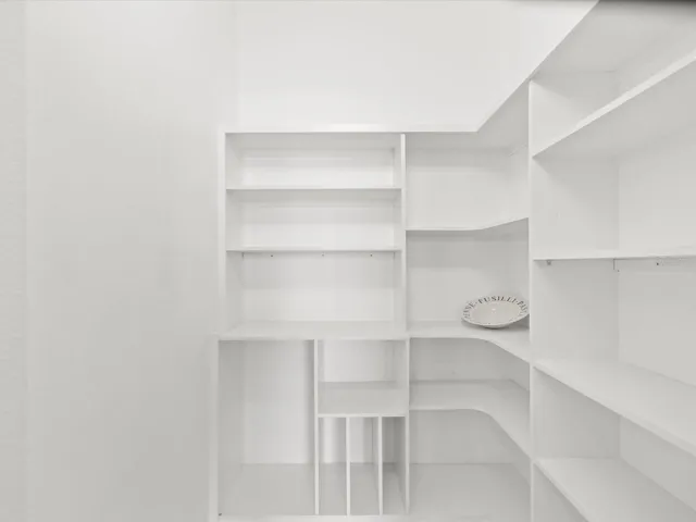 Custom built shelves in the kitchen pantry