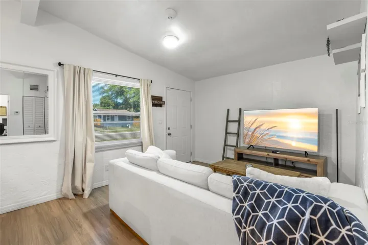 Bright and inviting living room with durable laminate flooring and abundant natural light.