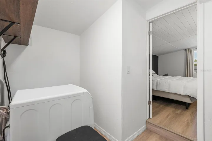 Laundry room located just off the primary bedroom adds everyday convenience and organization.