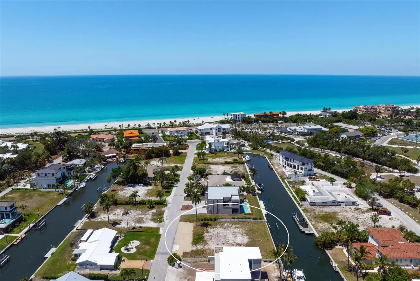 Drone view showing canals on each street in Longboat Key Estates.
