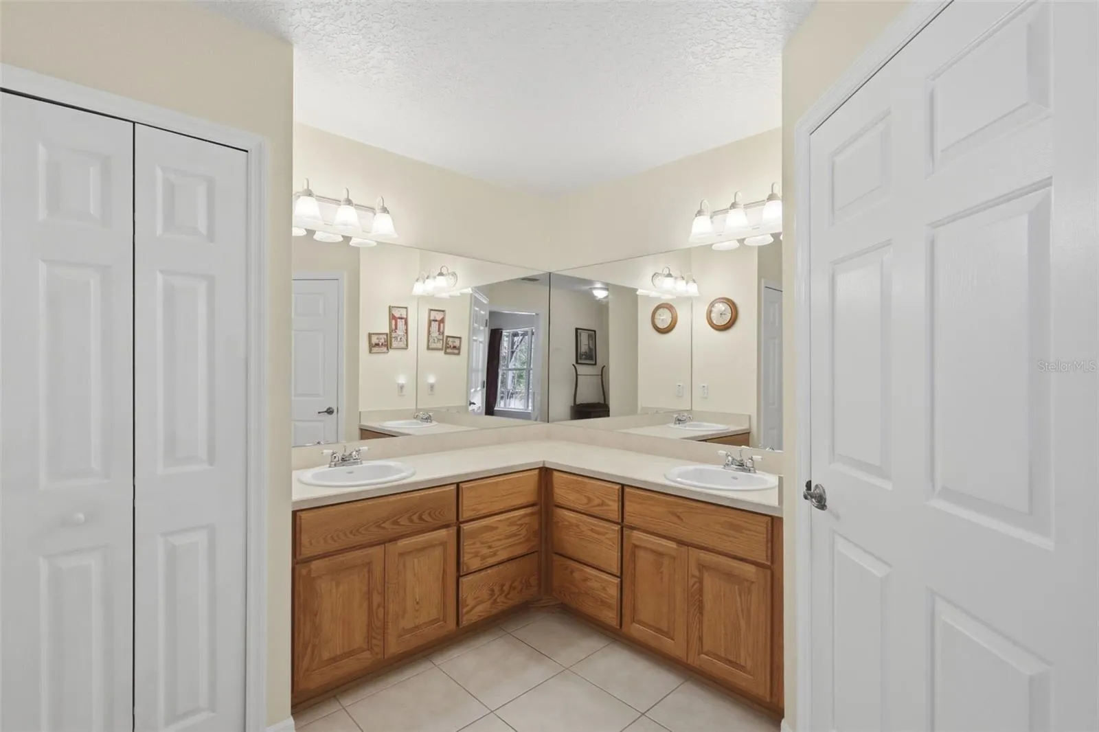 Primary Bath with storage closet and separate toilet room