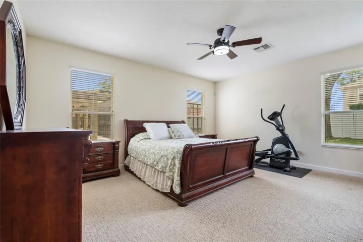 Oversized Primary Suite with sitting area and access to porch