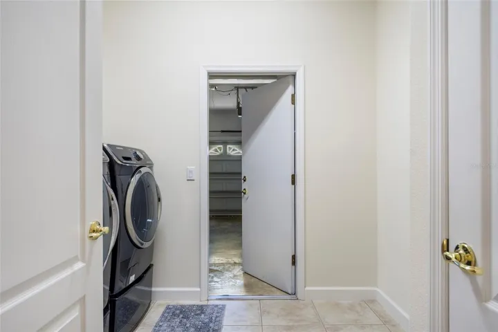 Inside Laundry Room with Front Loading Washer & Dryer