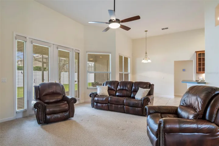 Family Room with French  Doors to covered screened Porch
