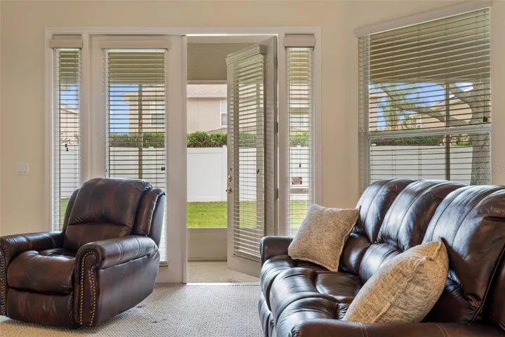 Family Room with French  Doors to covered screened Porch